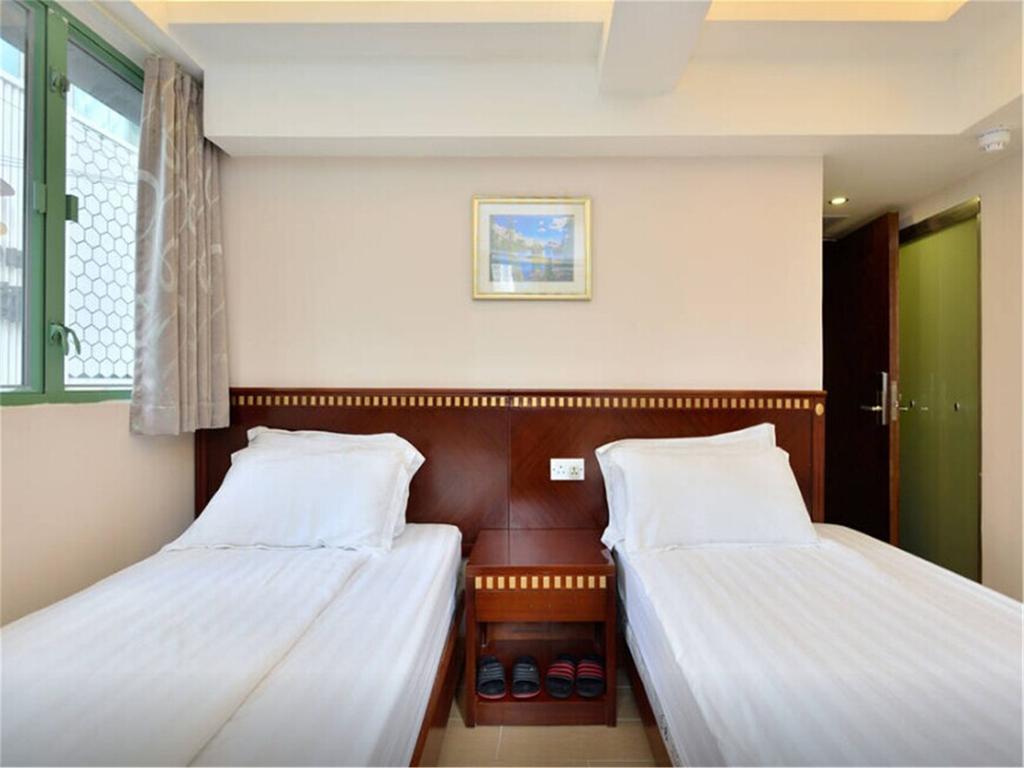Mingdu Hostel Цзюлун Экстерьер фото