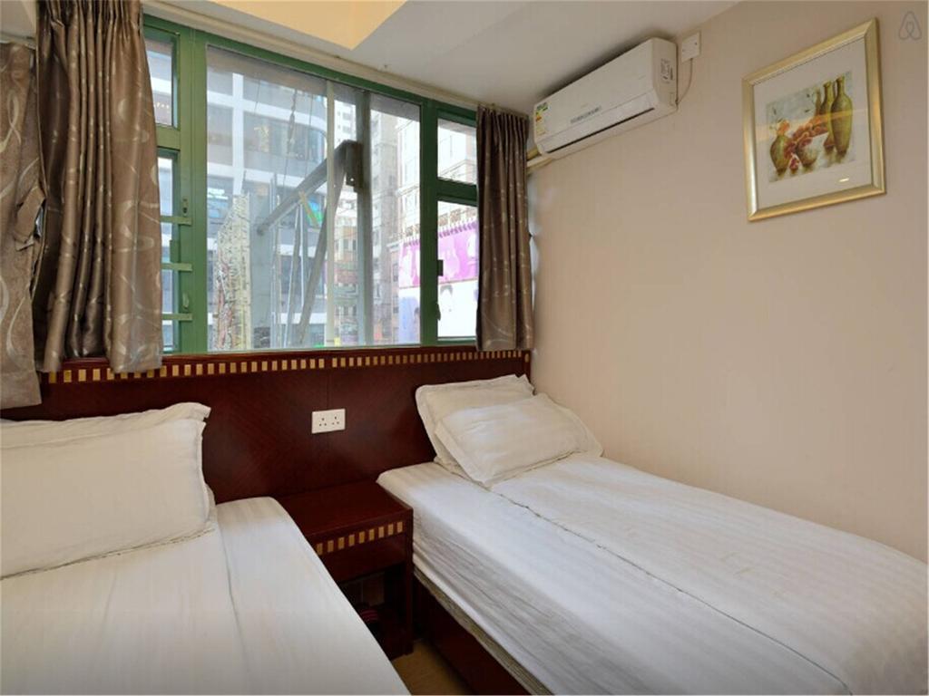 Mingdu Hostel Цзюлун Экстерьер фото