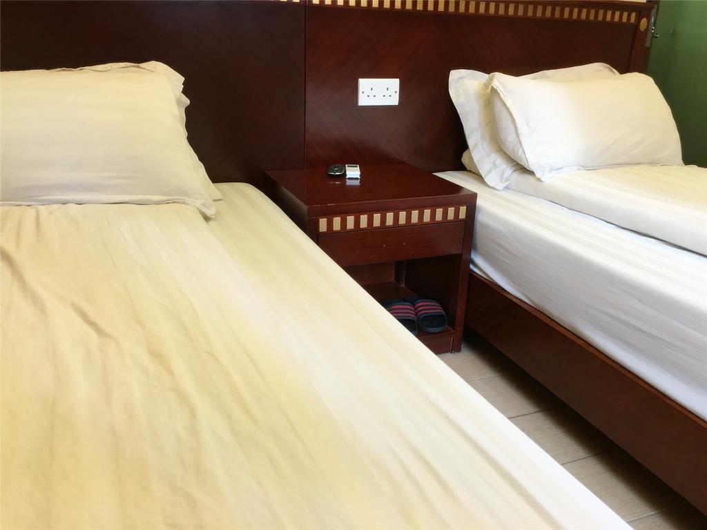 Mingdu Hostel Цзюлун Экстерьер фото