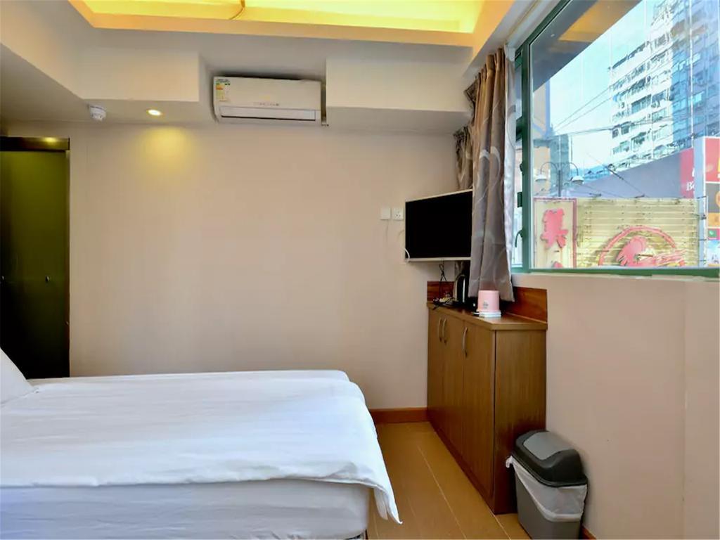 Mingdu Hostel Цзюлун Экстерьер фото