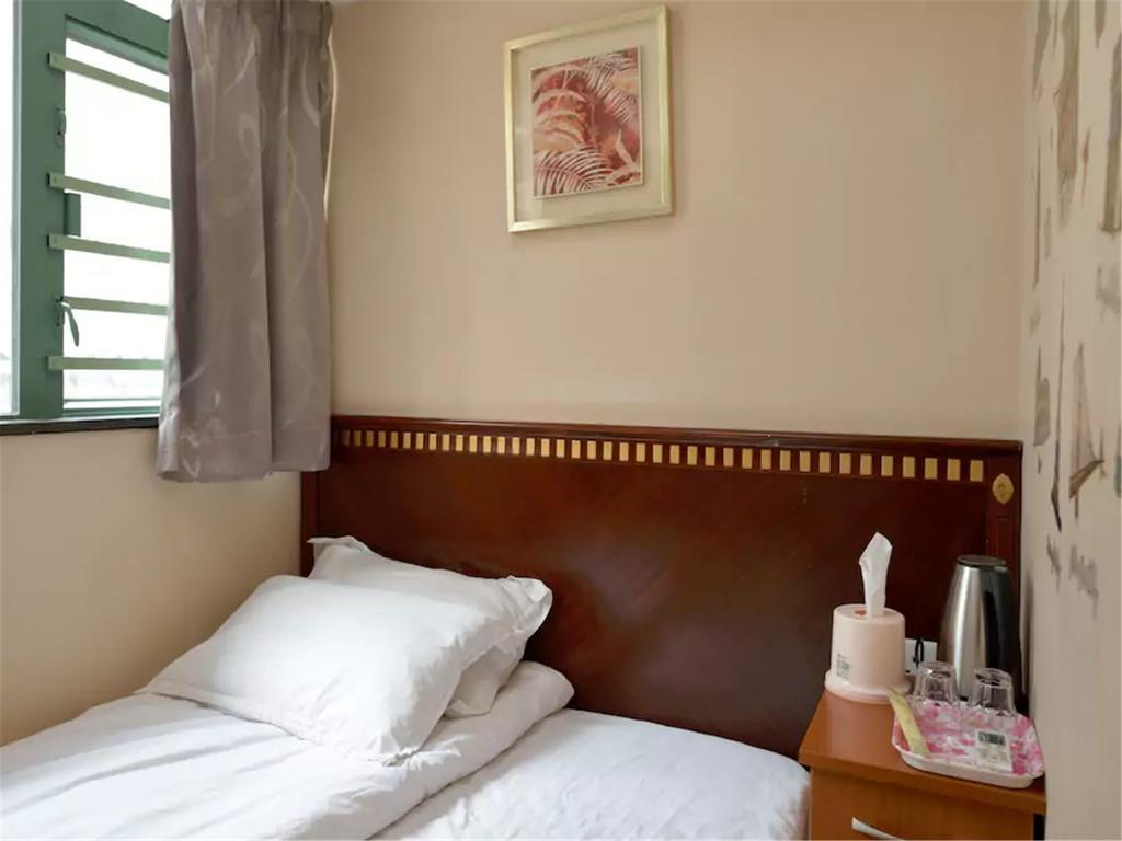 Mingdu Hostel Цзюлун Экстерьер фото