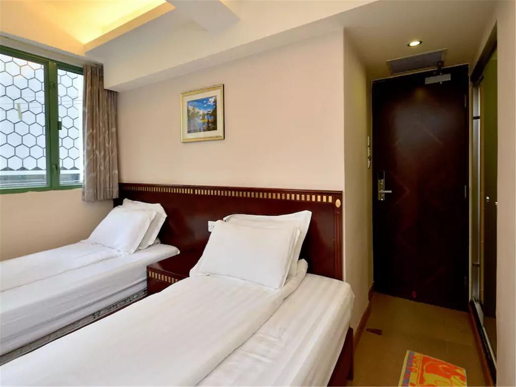 Mingdu Hostel Цзюлун Экстерьер фото
