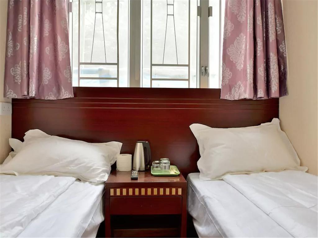 Mingdu Hostel Цзюлун Экстерьер фото