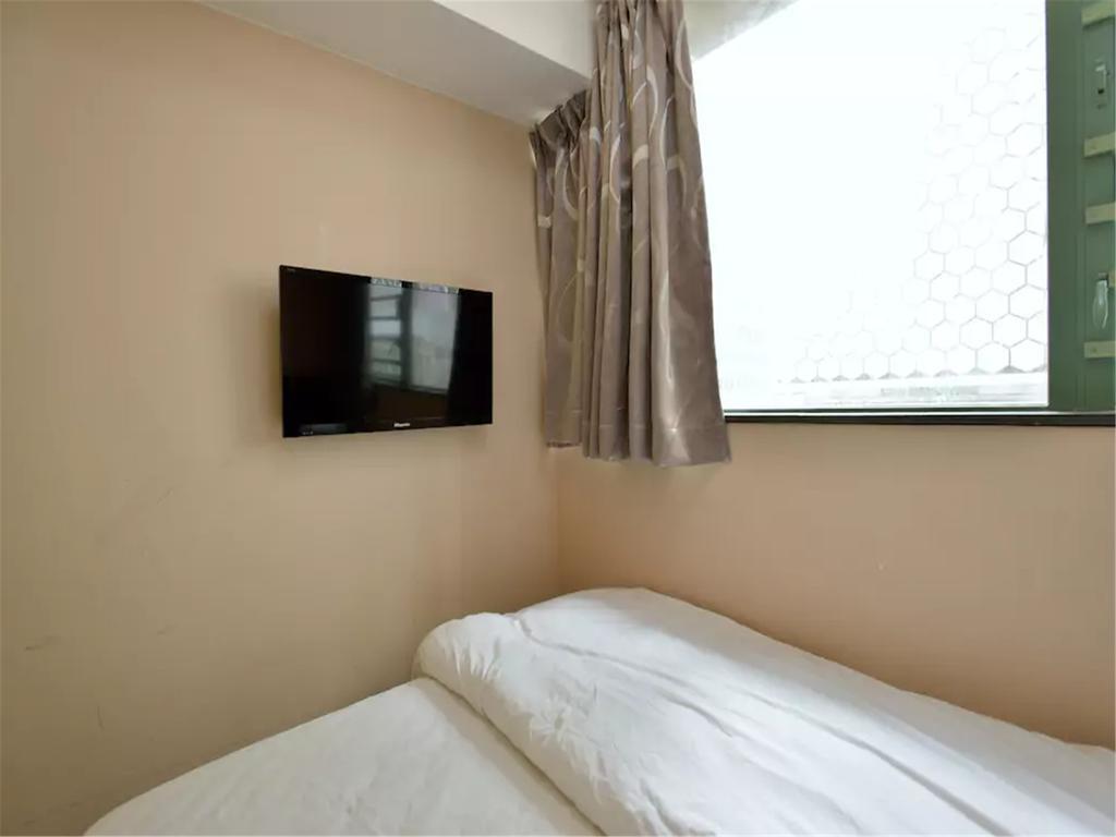 Mingdu Hostel Цзюлун Экстерьер фото