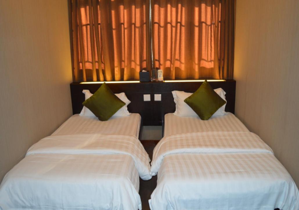 Mingdu Hostel Цзюлун Экстерьер фото