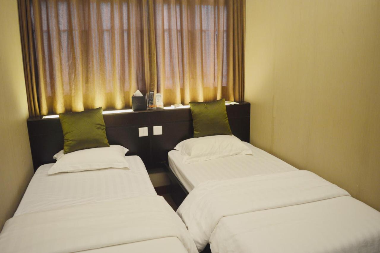 Mingdu Hostel Цзюлун Экстерьер фото