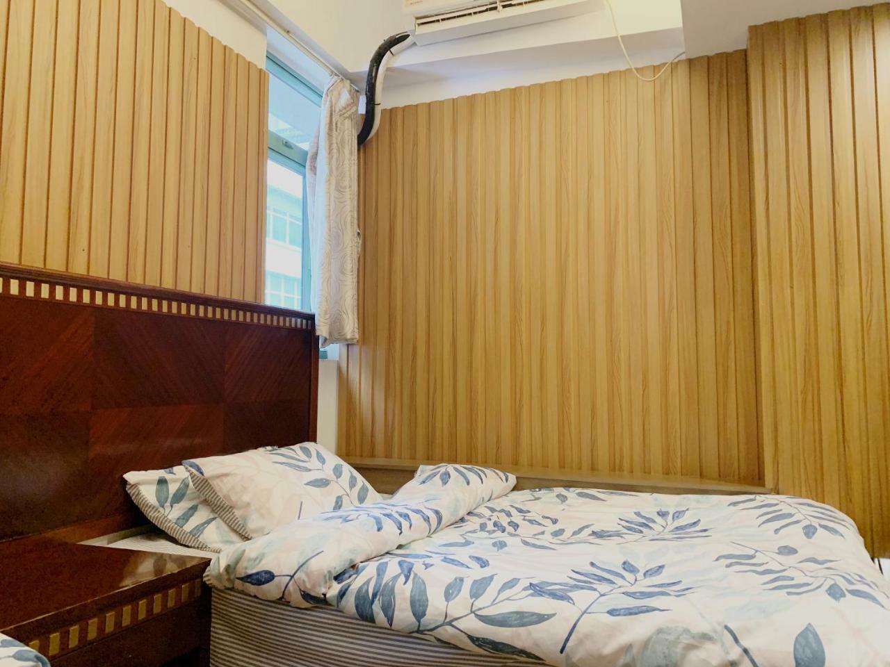 Mingdu Hostel Цзюлун Экстерьер фото