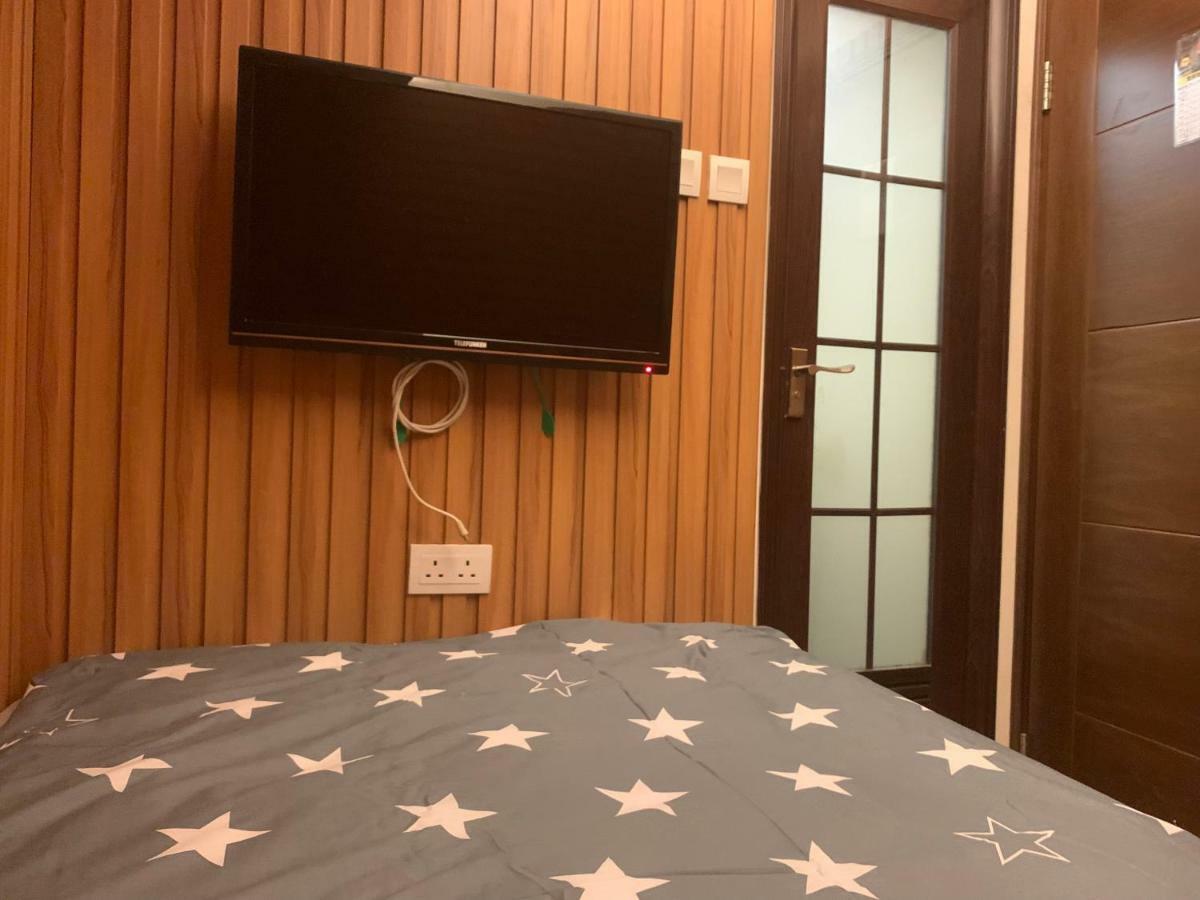 Mingdu Hostel Цзюлун Экстерьер фото