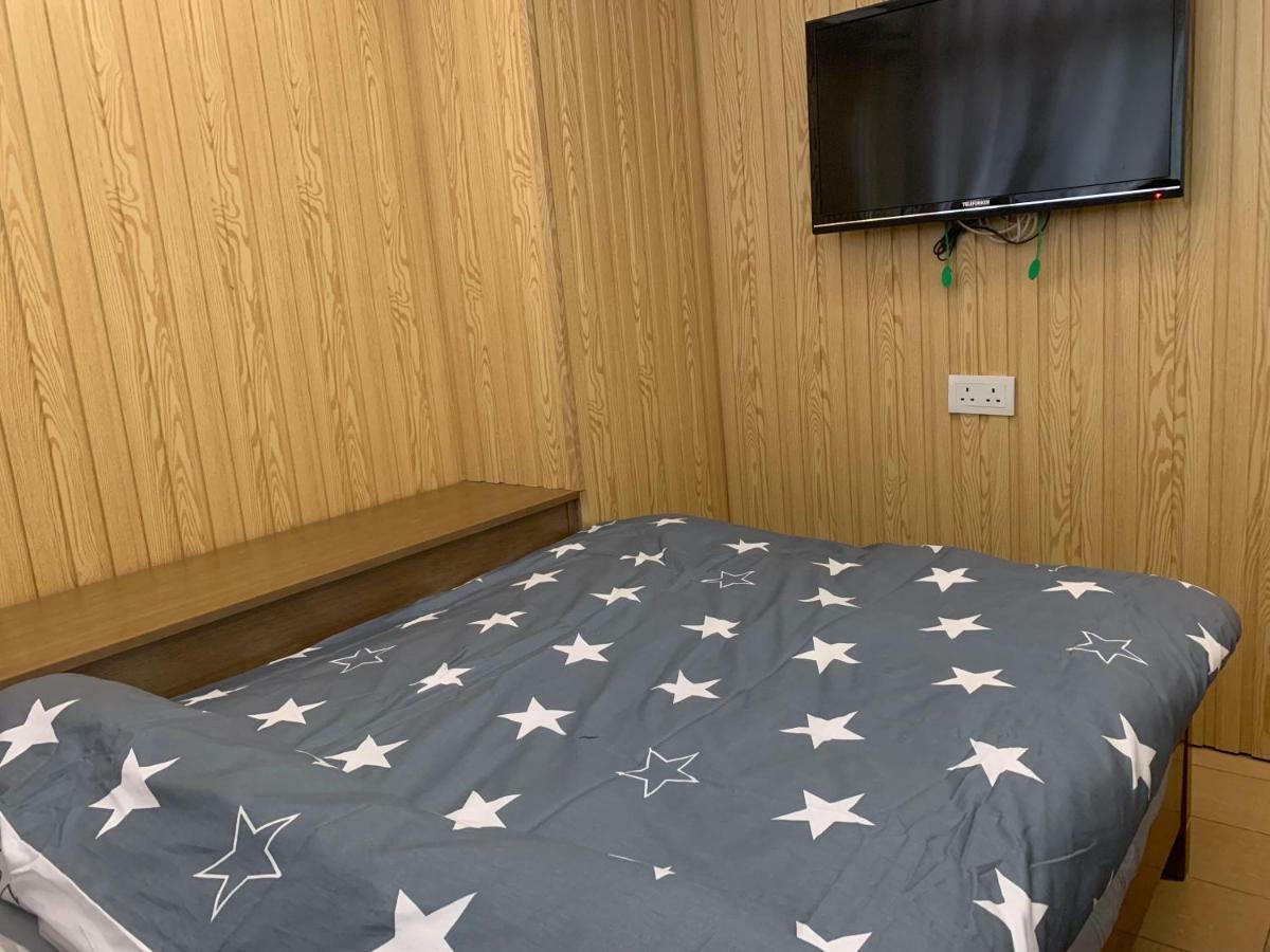 Mingdu Hostel Цзюлун Экстерьер фото