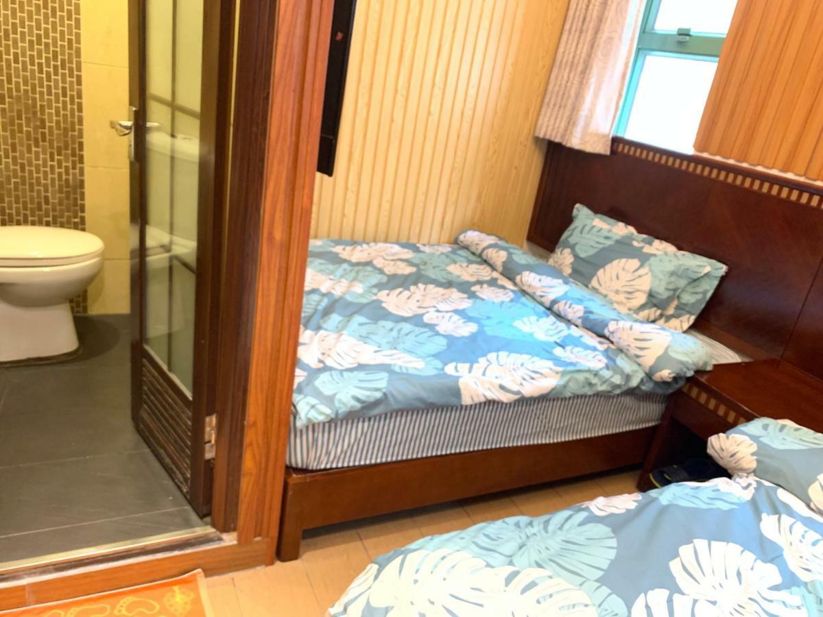 Mingdu Hostel Цзюлун Экстерьер фото