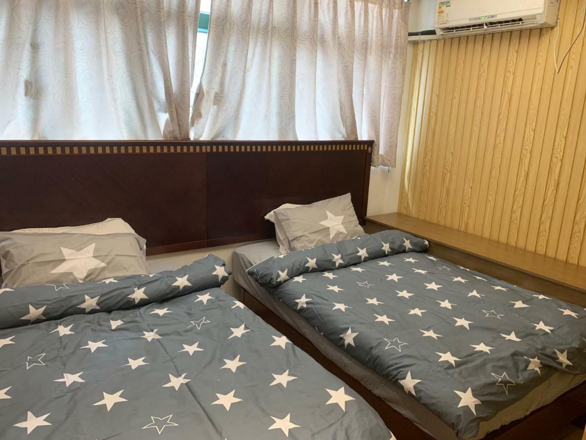 Mingdu Hostel Цзюлун Экстерьер фото