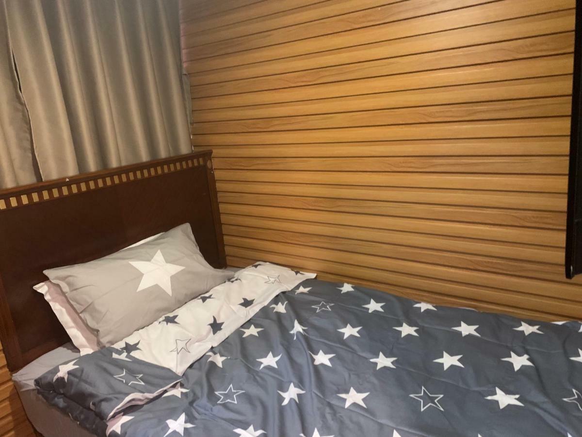 Mingdu Hostel Цзюлун Экстерьер фото