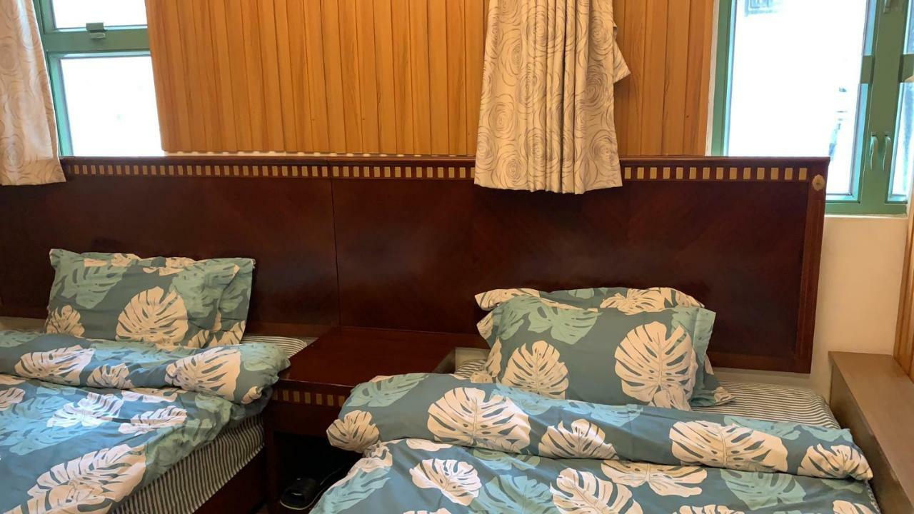 Mingdu Hostel Цзюлун Экстерьер фото