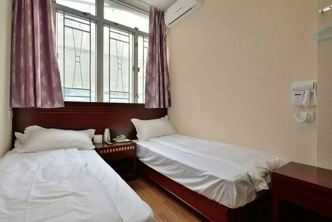 Mingdu Hostel Цзюлун Экстерьер фото